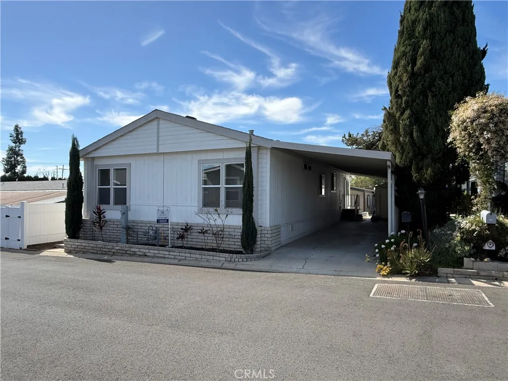1051 Site, Unit 255 Brea, CA 92821 - Photo 3 of 30 a front view of a house with a garden