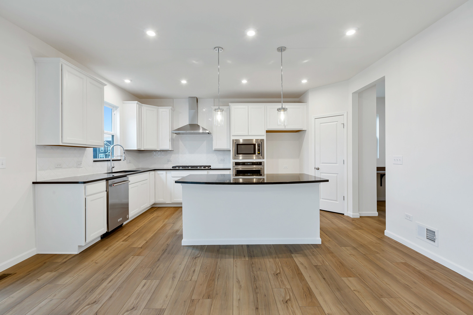 2120 Schmitt Circle Algonquin, IL 60102 - Photo 13 of 24 a kitchen with stainless steel appliances granite countertop wooden cabinets a sink a stove a refrigerator and white cabinets