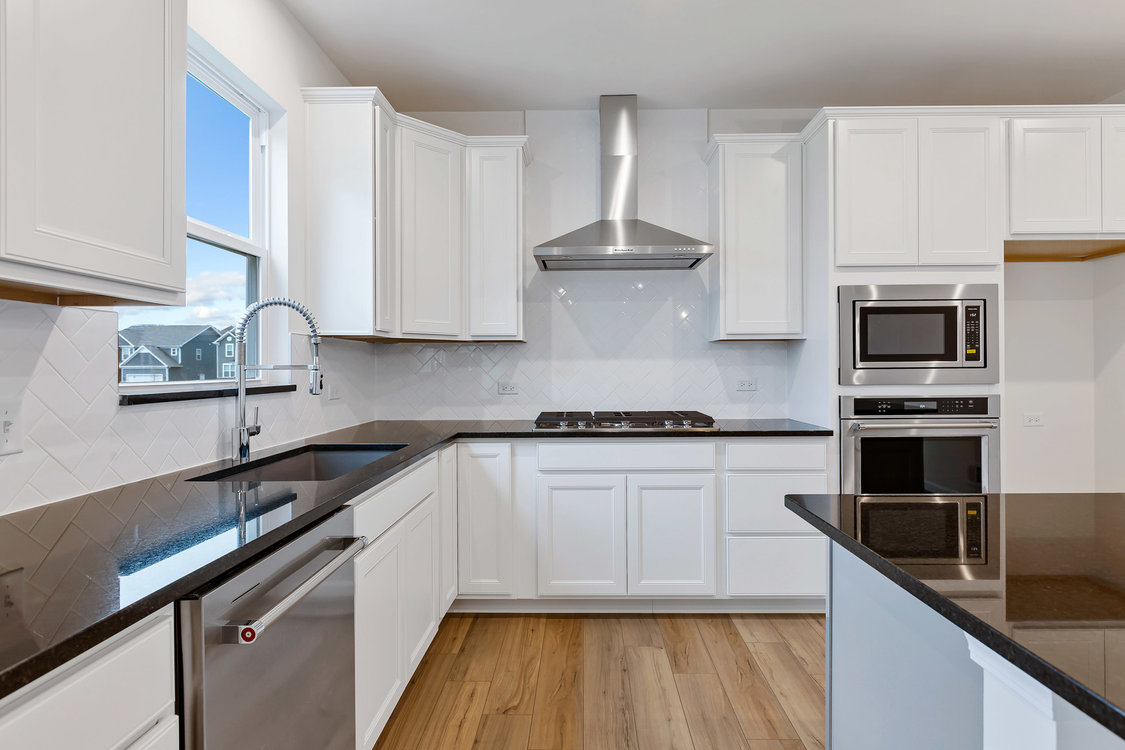 2120 Schmitt Circle Algonquin, IL 60102 - Photo 15 of 24 a kitchen with kitchen island granite countertop a sink cabinets and stainless steel appliances