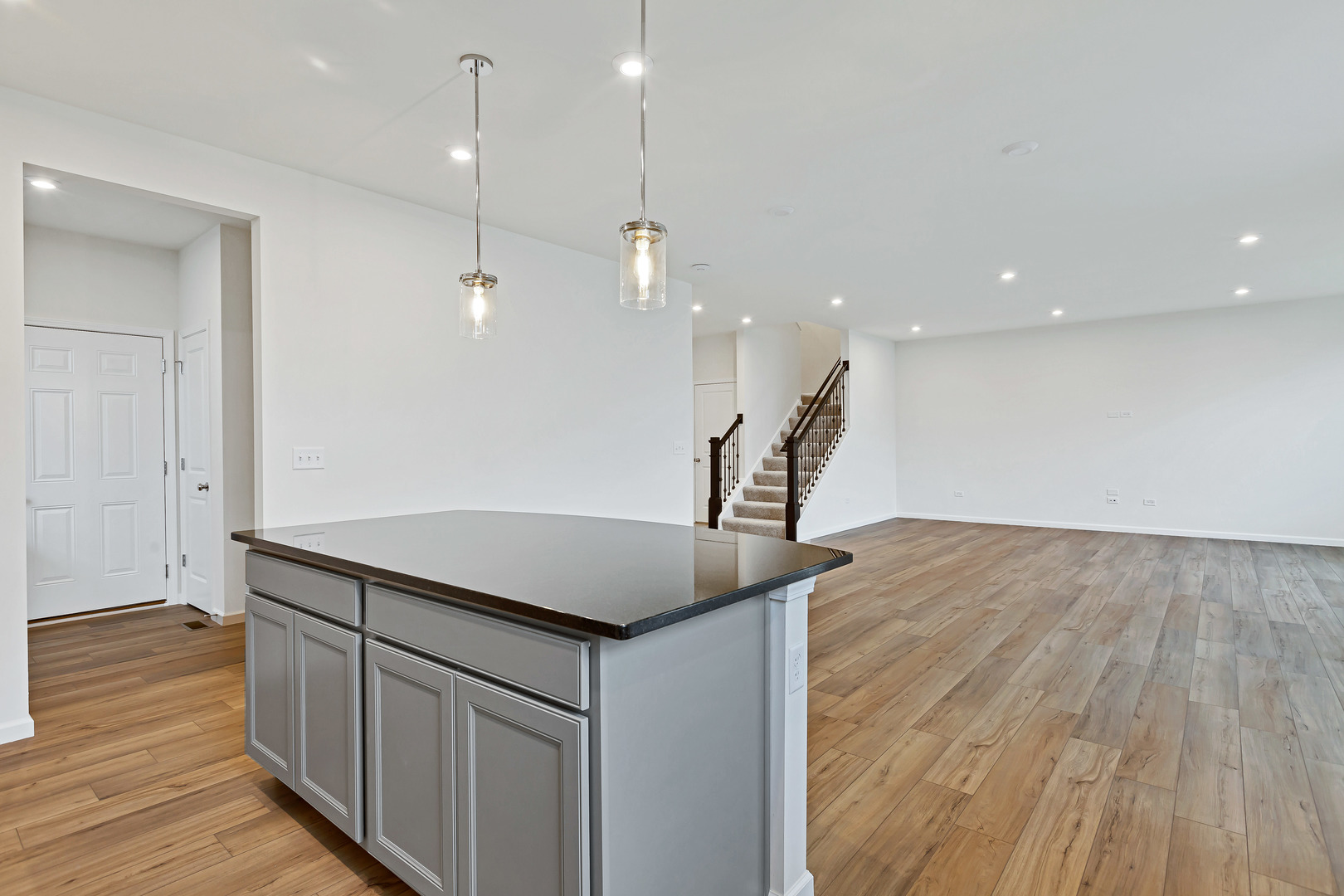 2120 Schmitt Circle Algonquin, IL 60102 - Photo 16 of 24 an open kitchen with a sink and wooden floor