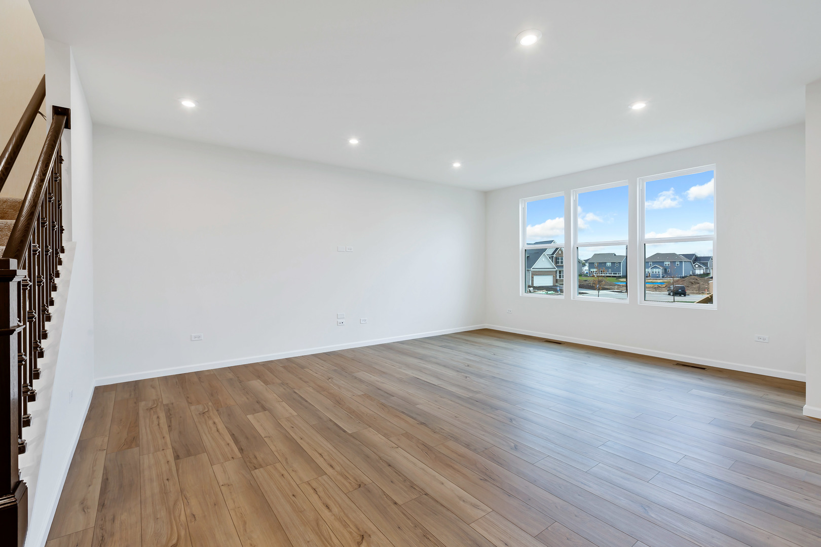 2120 Schmitt Circle Algonquin, IL 60102 - Photo 5 of 24 an empty room with wooden floor and windows