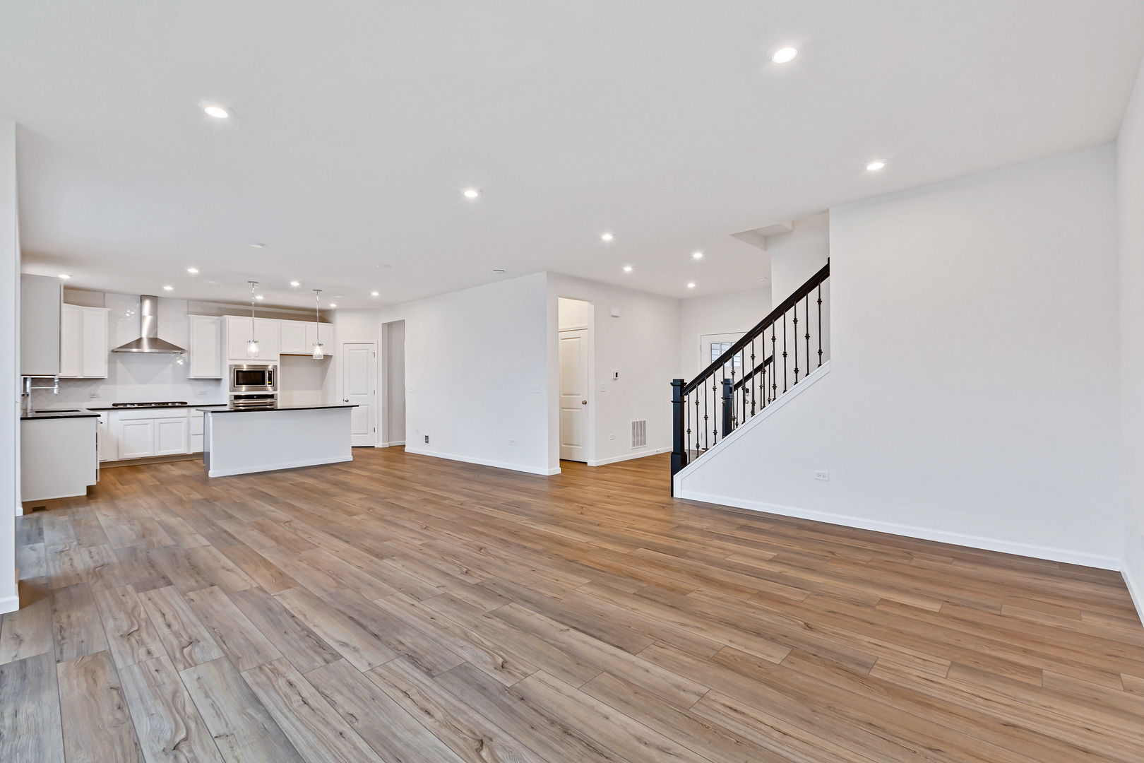 2120 Schmitt Circle Algonquin, IL 60102 - Photo 7 of 24 a view of kitchen island wooden floor and kitchen