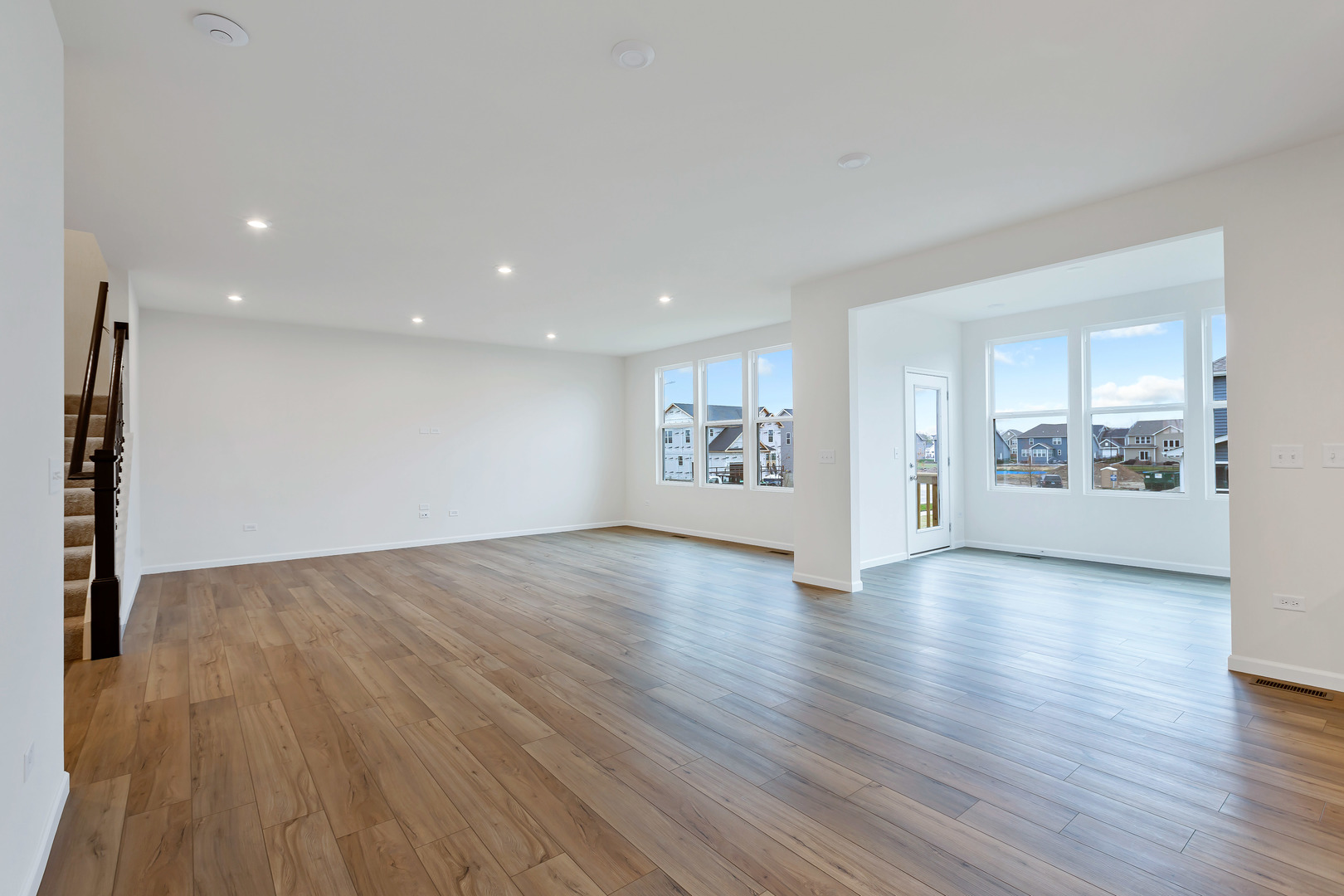 2120 Schmitt Circle Algonquin, IL 60102 - Photo 10 of 24 a view of an empty room with wooden floor and a window