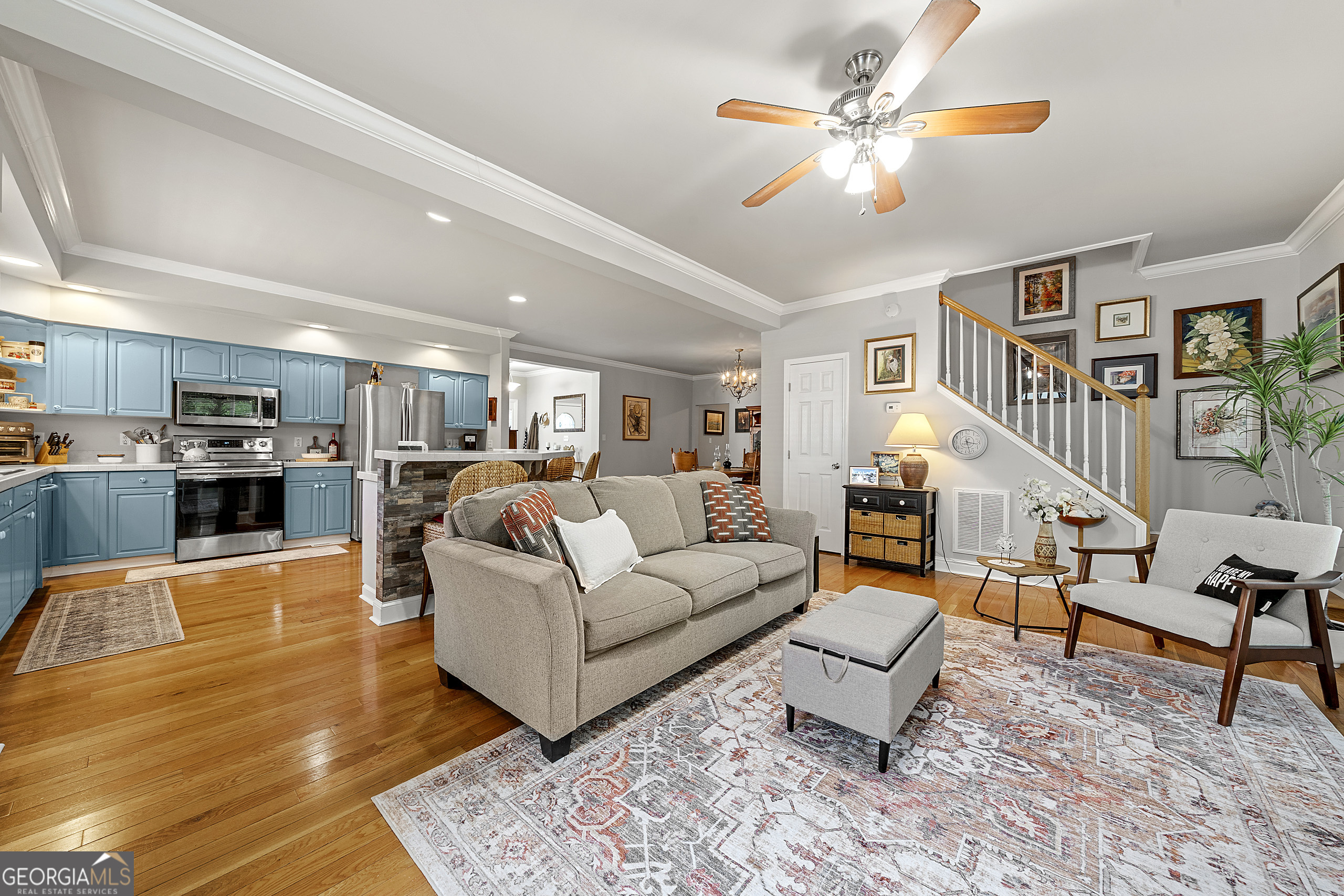 400 Sapling Court Temple, GA 30179 - Photo 17 of 55 a living room with furniture kitchen view and a wooden floor
