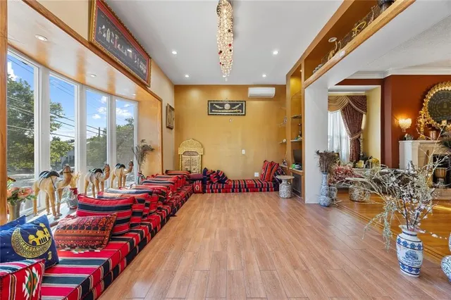 a very nice looking bedroom with large windows