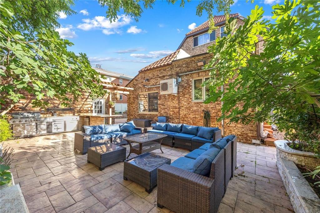 139 86th Street Brooklyn, NY 11209 - Photo 19 of 34 a outdoor space with patio couches and a potted plant