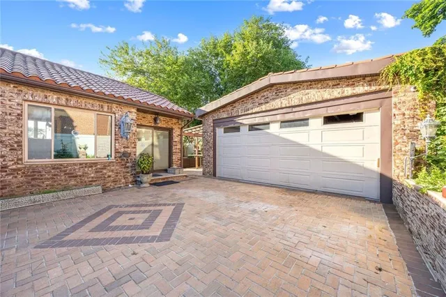 a view of backyard with a patio and a garden