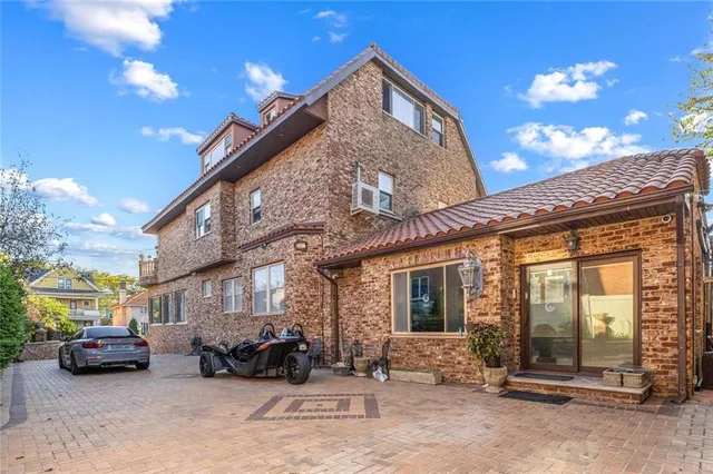 a view of a car park in front of house