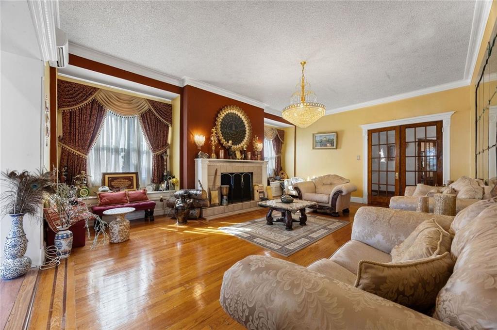 139 86th Street Brooklyn, NY 11209 - Photo 3 of 34 a living room with fireplace furniture and a large window