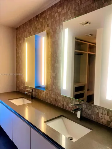 a view of a kitchen with a sink and dishwasher