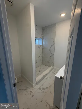 a bathroom with a shower and toilet
