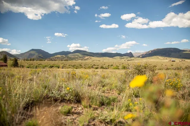 a view of a lake and sunset