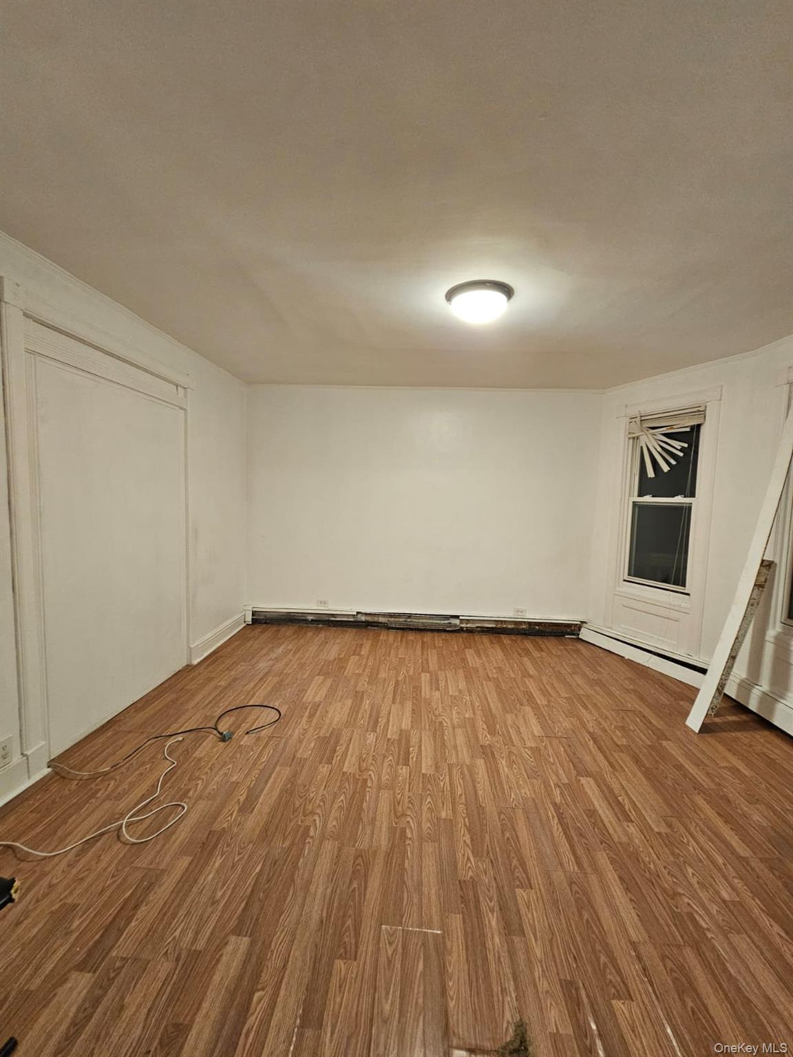 36 Prospect Street Middletown, NY 10940 - Photo 11 of 12 a view of an empty room and wooden floor