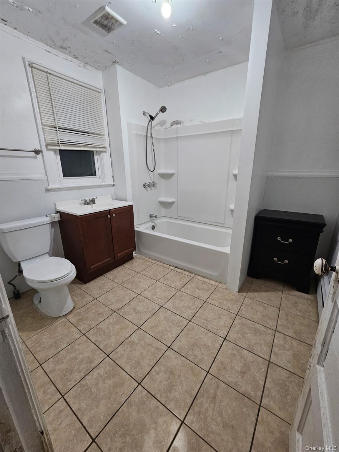 36 Prospect Street Middletown, NY 10940 - Photo 7 of 12 a bathroom with a sink a toilet and bathtub