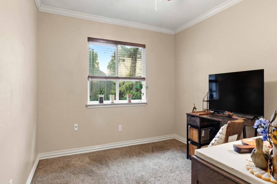 9211 Benwick Street Spring, TX 77379 - Photo 19 of 27 a view of a workspace with a window