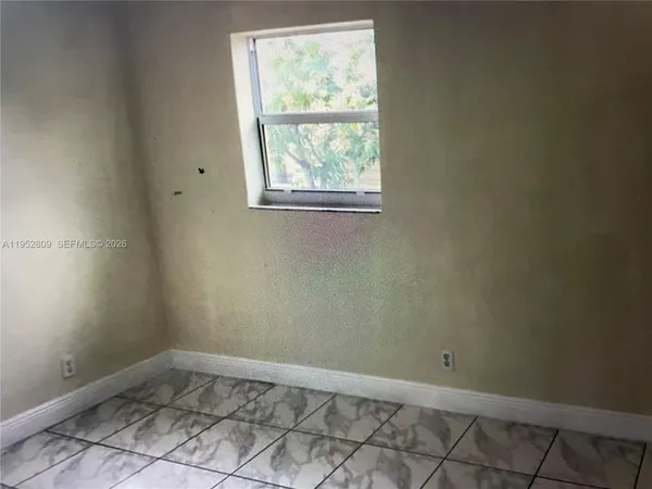 an empty room with a window