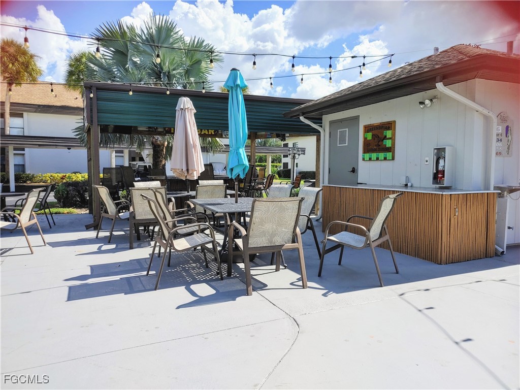 5830 Trailwinds Drive, Unit 813 Fort Myers, FL 33907 - Photo 26 of 39 a view of outdoor space and patio