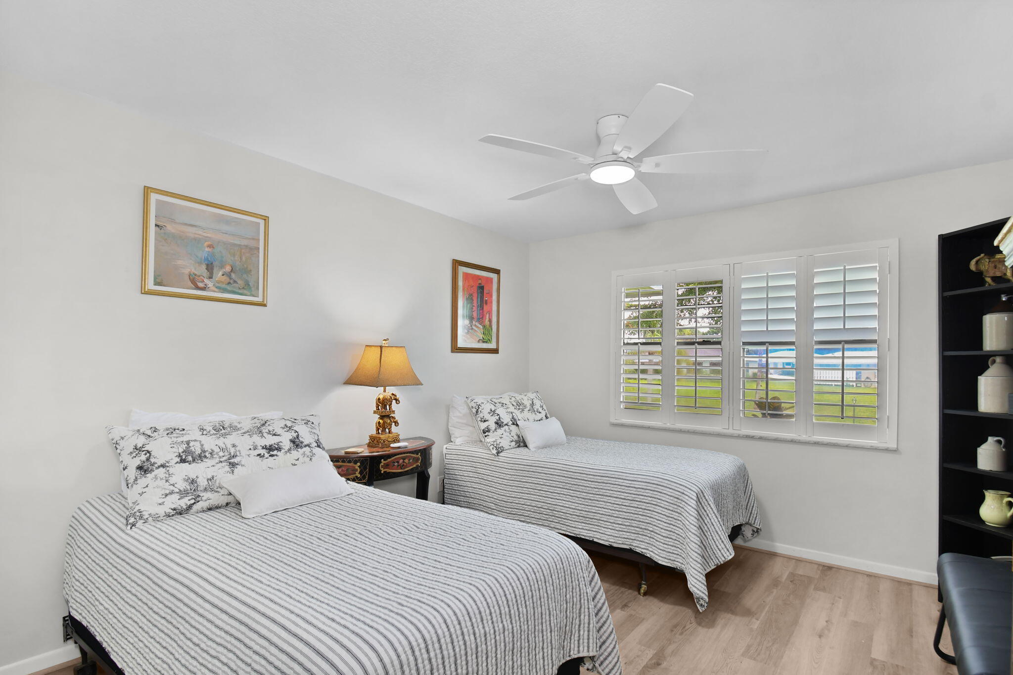 5251 Southeast Sea Island Way Stuart, FL 34997 - Photo 24 of 68 a bedroom with a bed and a window