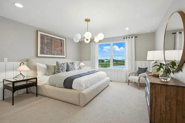 a spacious bedroom with a bed and a couch