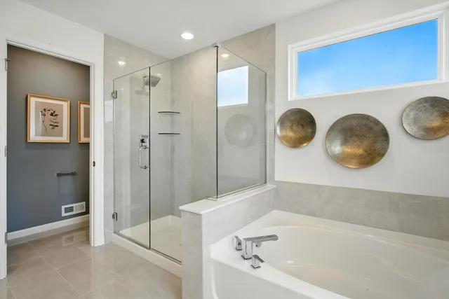 a bathroom with a bathtub and a shower