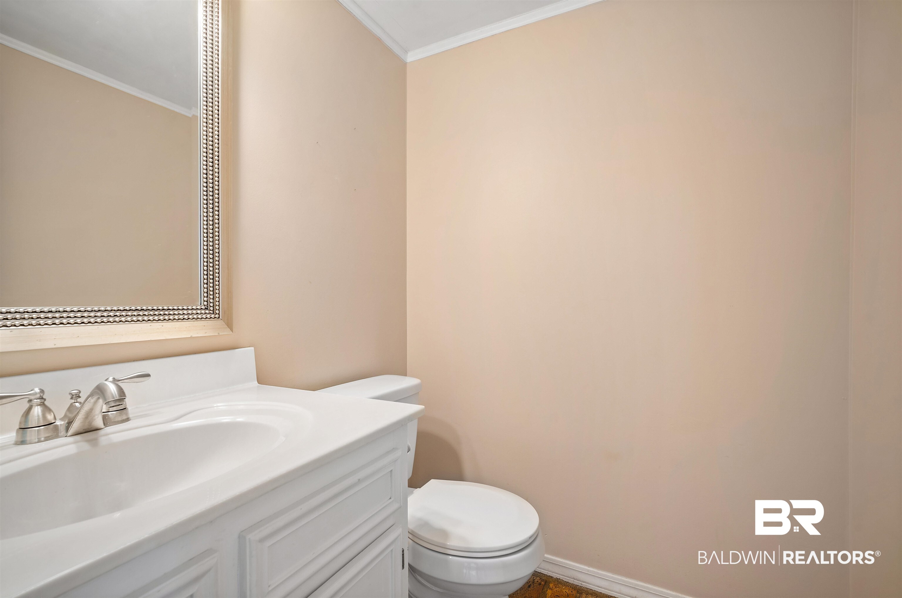 804 Wildwood Avenue Mobile, AL 36609 - Photo 26 of 30 half Bath downstairs featuring toilet, crown molding, and vanity
