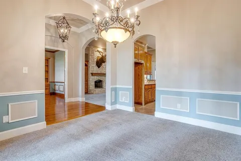en view of a livingroom with a chandelier