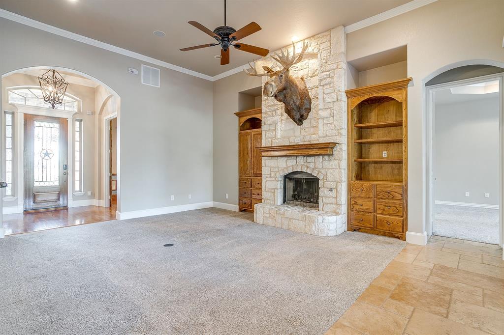 9549 Dickson Road Fort Worth, TX 76179 - Photo 13 of 40 wooden floor fireplace and windows in a room