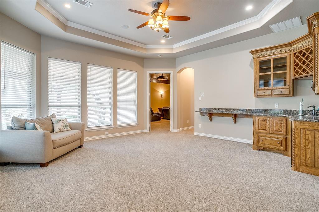 9549 Dickson Road Fort Worth, TX 76179 - Photo 20 of 40 a living room with furniture and large windows