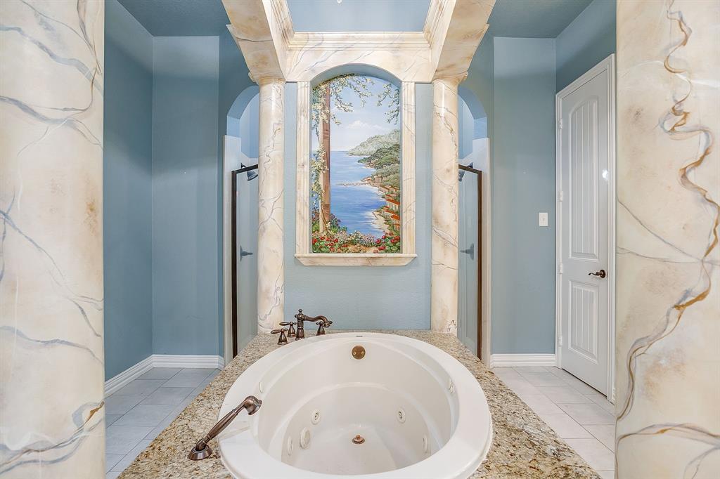 9549 Dickson Road Fort Worth, TX 76179 - Photo 26 of 40 a bathroom with a tub and shower