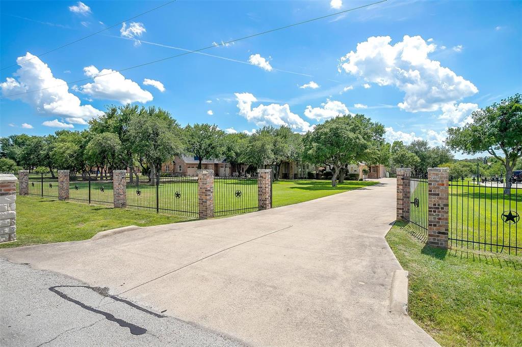 9549 Dickson Road Fort Worth, TX 76179 - Photo 3 of 40 a view of a park with large trees