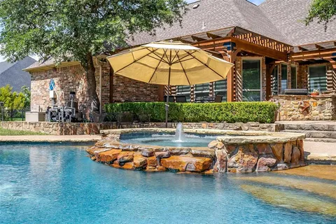 a view of a swimming pool with a lounge chairs