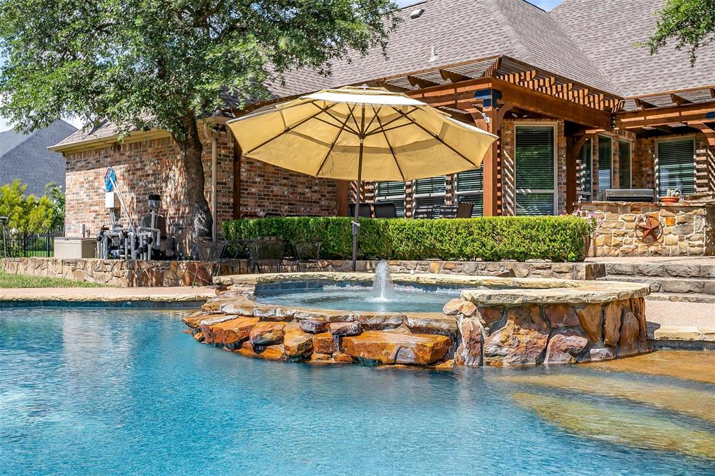 9549 Dickson Road Fort Worth, TX 76179 - Photo 36 of 40 a view of a swimming pool with a lounge chairs