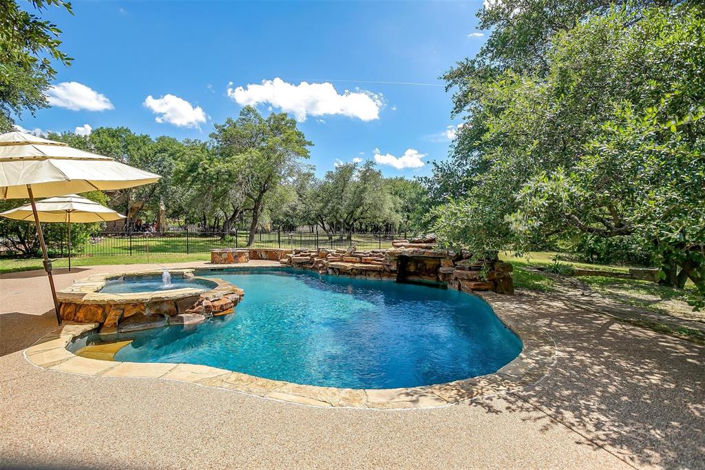 9549 Dickson Road Fort Worth, TX 76179 - Photo 37 of 40 a view of a swimming pool with a yard and sitting area