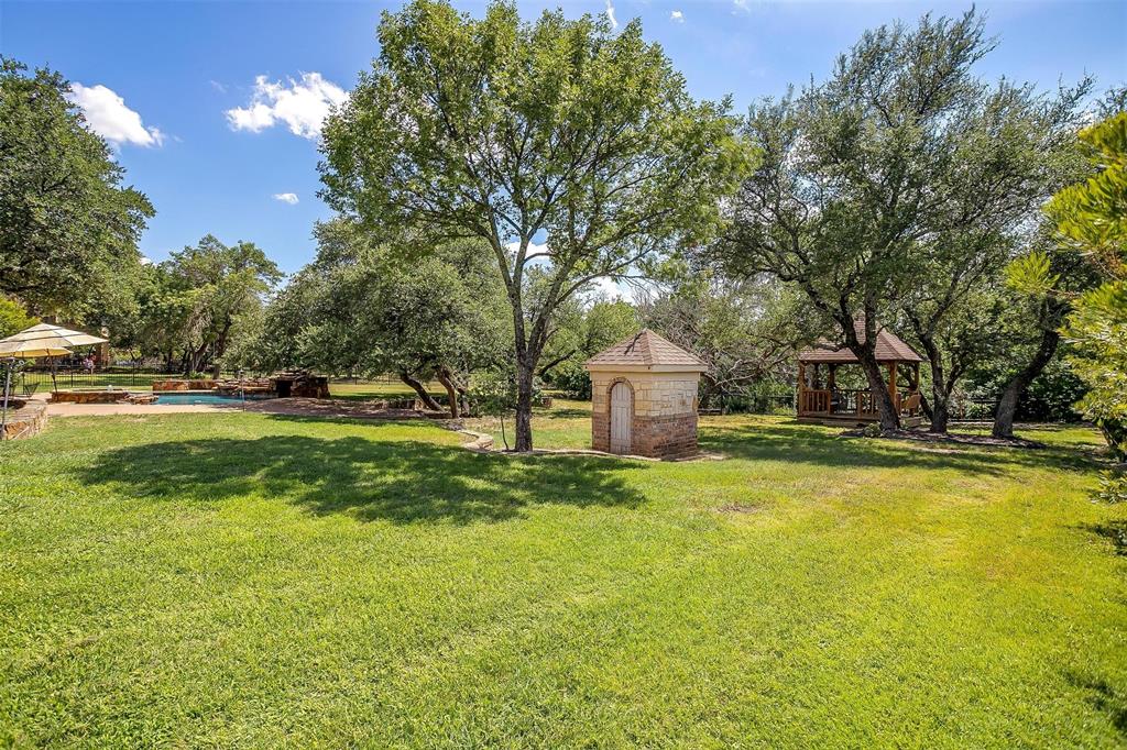 9549 Dickson Road Fort Worth, TX 76179 - Photo 38 of 40 a view of a house with a yard and tree s