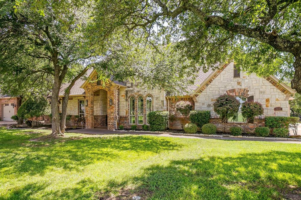 9549 Dickson Road Fort Worth, TX 76179 - Photo 5 of 40 a front view of a house with a yard