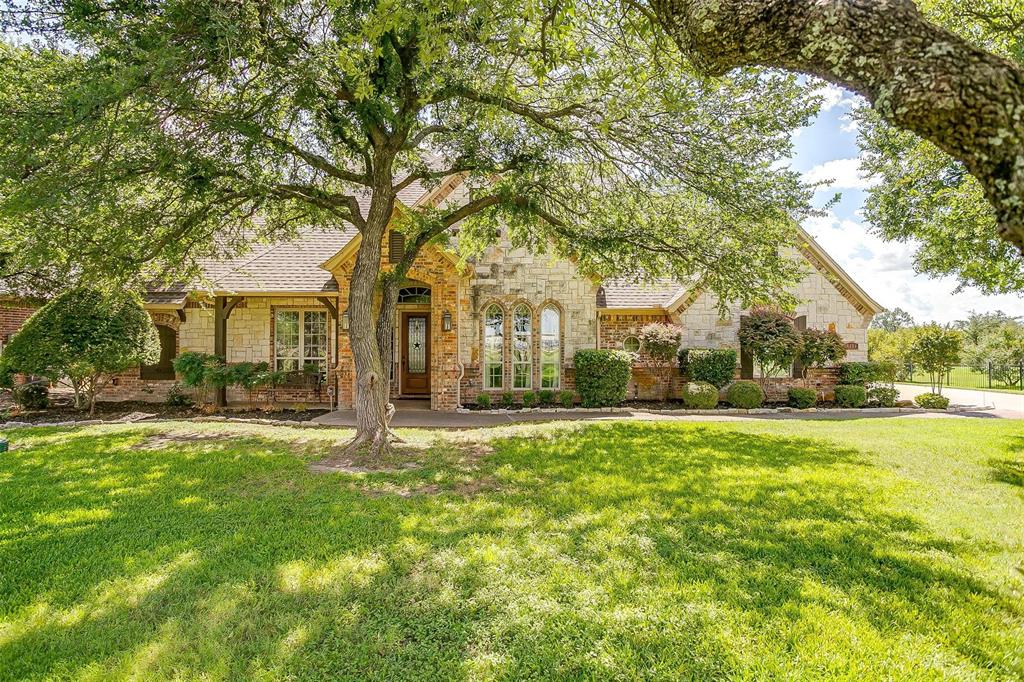 9549 Dickson Road Fort Worth, TX 76179 - Photo 6 of 40 a house with huge green field in front of it