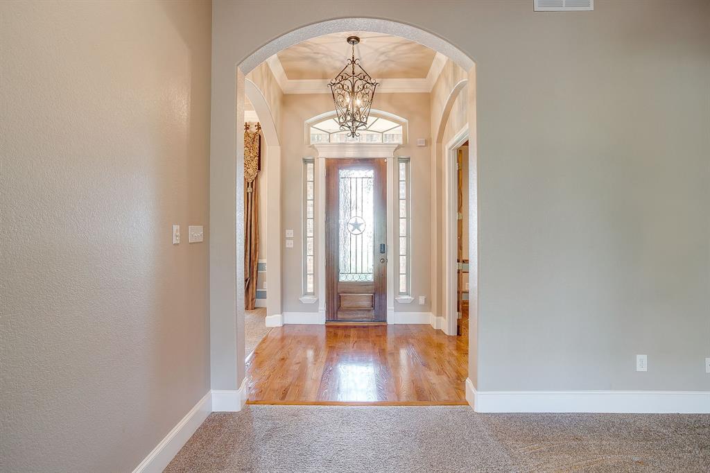 9549 Dickson Road Fort Worth, TX 76179 - Photo 7 of 40 wooden floor in an entryway with a chandelier