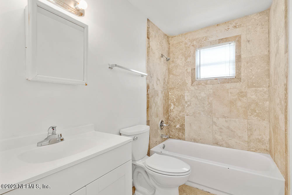 10571 Villanova Road Jacksonville, FL 32218 - Photo 15 of 21 a bathroom with a sink toilet and shower