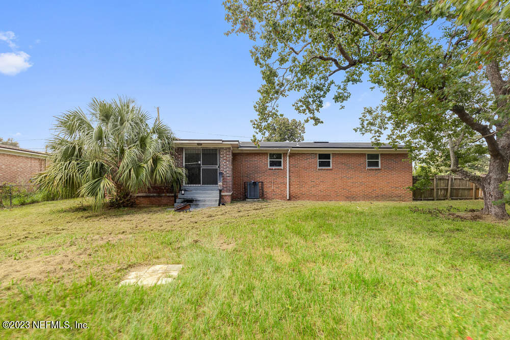 10571 Villanova Road Jacksonville, FL 32218 - Photo 20 of 21 front view of house with a yard