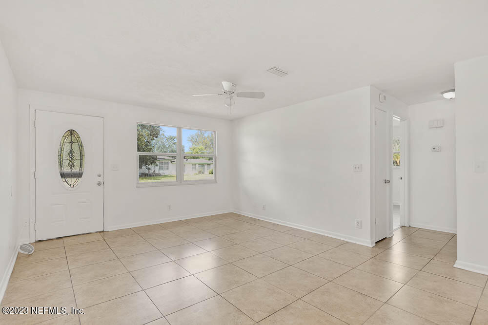 10571 Villanova Road Jacksonville, FL 32218 - Photo 4 of 21 a view of an empty room with a window