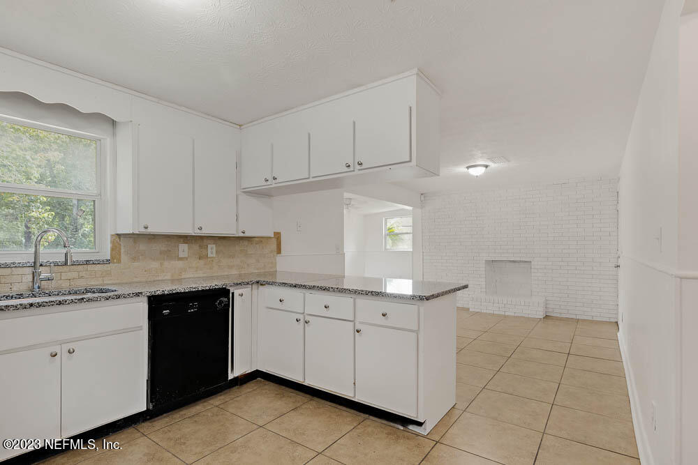 10571 Villanova Road Jacksonville, FL 32218 - Photo 8 of 21 a kitchen with a sink and cabinets