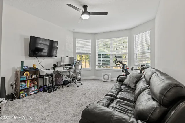 a bathroom with a sink a toilet a mirror a vanity and shower