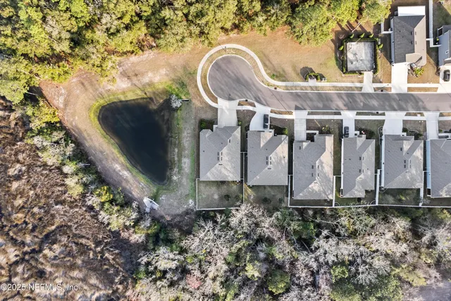 an aerial view of residential house with outdoor space