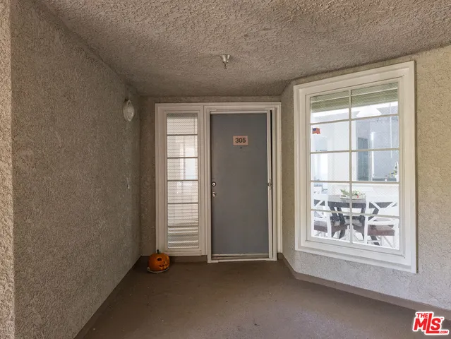 a view of yard with swimming pool and bench