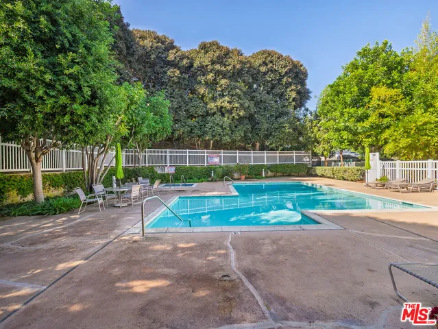 a view of a house with backyard and porch