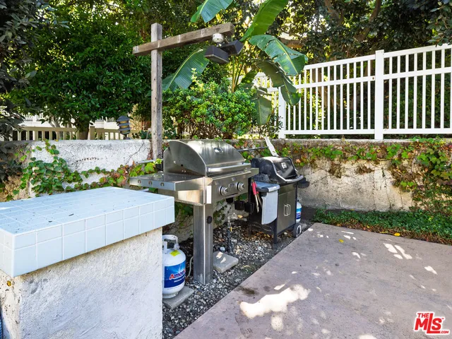 a room with pool table and windows
