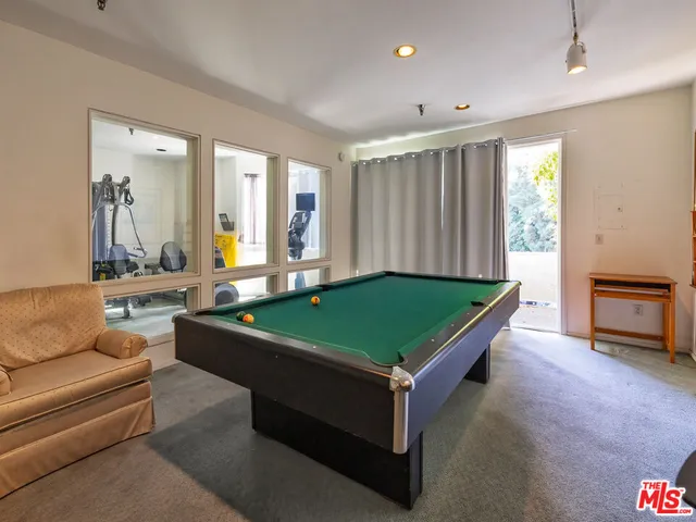 a front view of a house with a yard and a garage