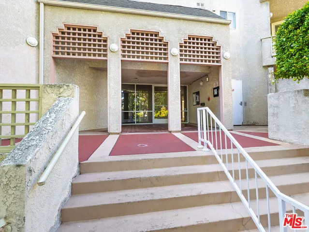 a front view of a house with a rug