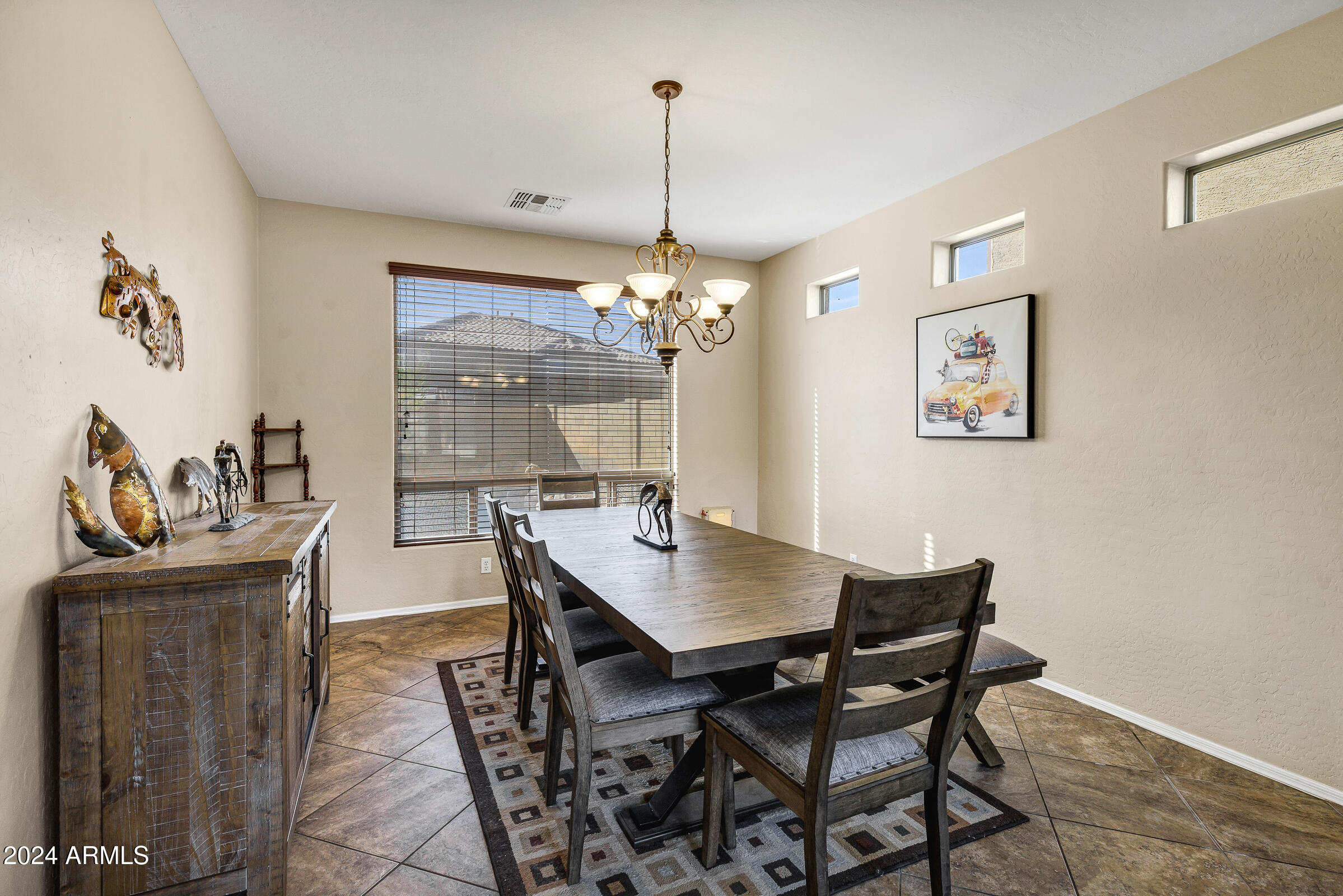 2801 West Silver Fox Way Phoenix, AZ 85045 - Photo 10 of 76 a view of a dining room with furniture window and outside view
