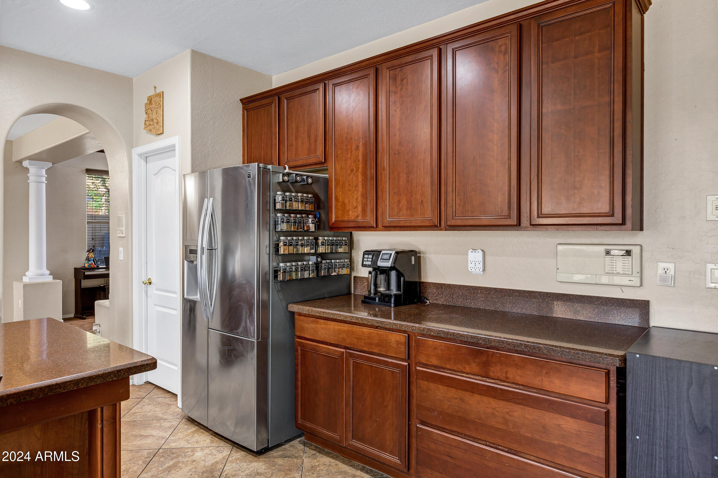 2801 West Silver Fox Way Phoenix, AZ 85045 - Photo 17 of 76 a kitchen with stainless steel appliances granite countertop a refrigerator a sink and dishwasher